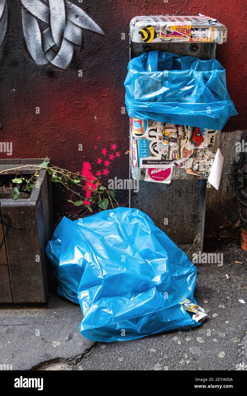 Pink and Blue Plastic Trash Bags on the Sidewalk Stock Image - Image of  garbage, rubbish: 64874567