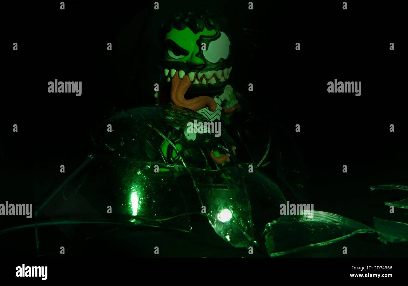 Venomized Hulk Glow In The Dark Mystery Mini with lighting effects and odd reflections under combined efforts of created green lighting shining upon Stock Photo