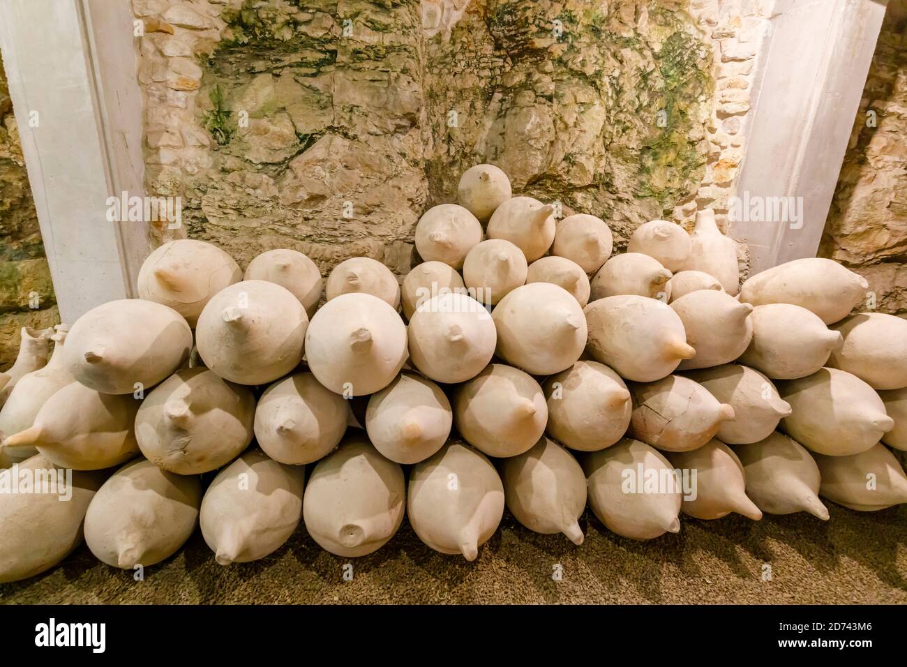 A pile of ceramic amphoras (storage jars), exhibits in the underground museum in the iconic ancient Roman amphitheatre at Pula, Istria, Croatia Stock Photo