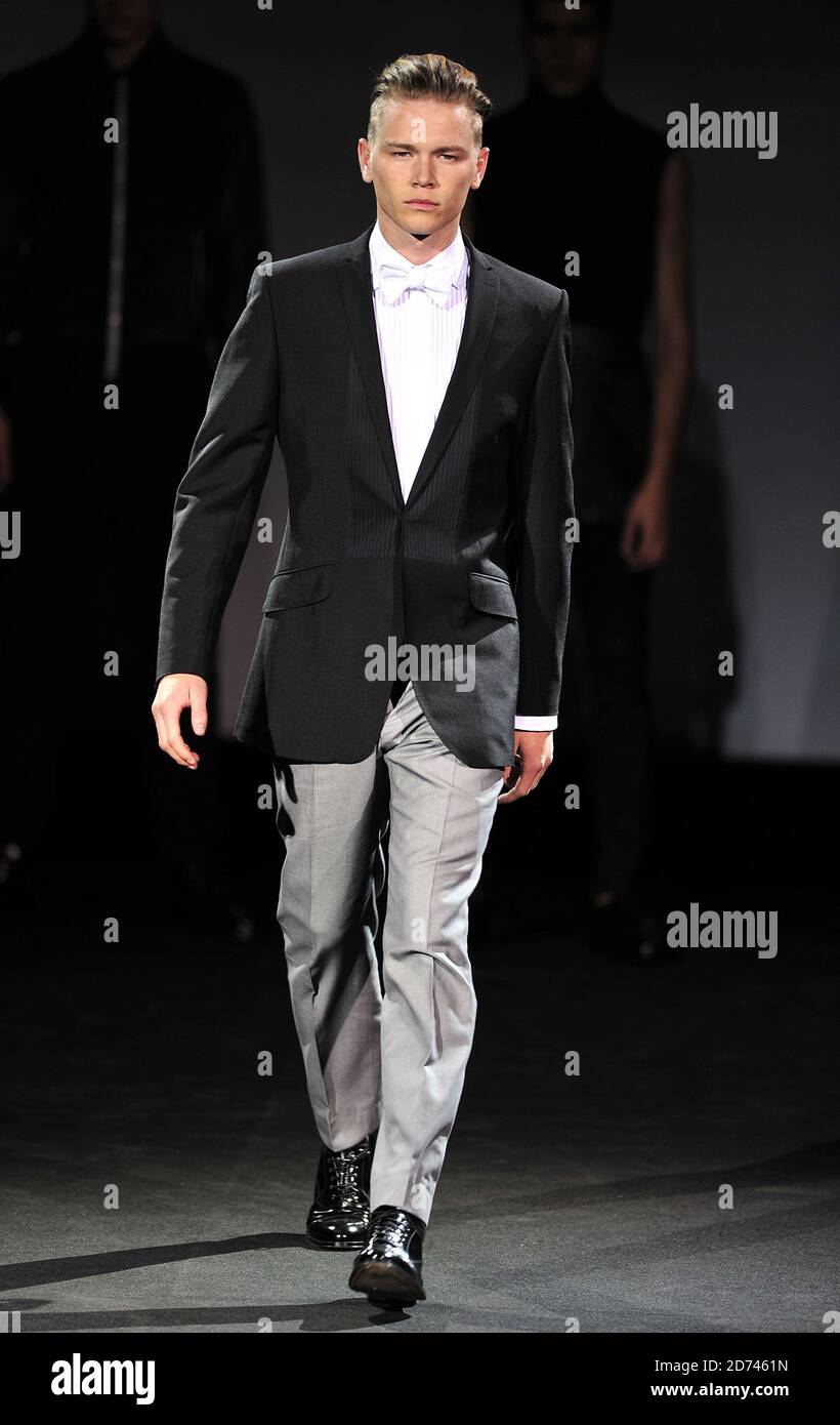 A model on the catwalk at the Ozwald Boateng fashion show, held at the Odeon Leicester Square in central London as part of London Fashion Week Spring/Summer 2011. Stock Photo