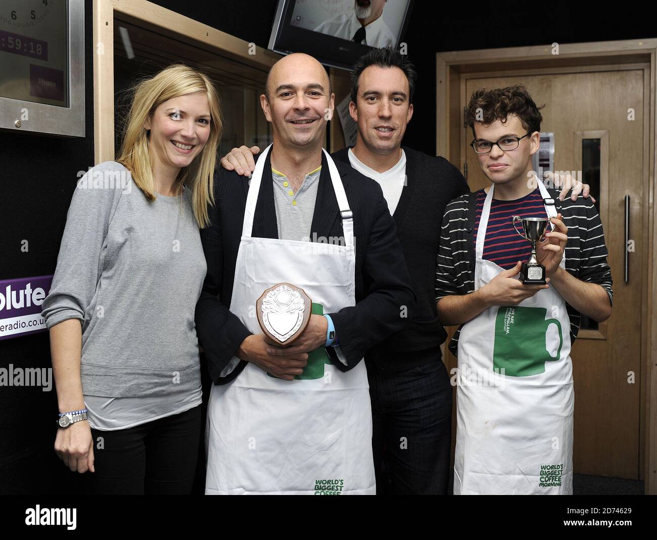 (l-r) Judge Lisa Faulkner, runner-up Philip Newton, Christian O'Connell and winner Luke Boatright pictured during the 'man bake' competition on Christian O'Connell's breakfast show, at the Absolute Radio studios in central London.  Stock Photo