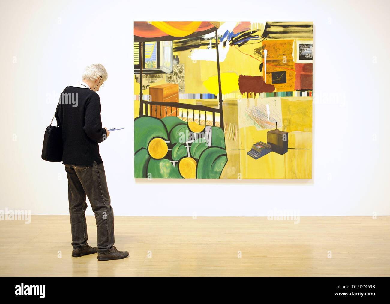 A visitor looks at works by Dexter Dalwood at the Turner  Prize 2010 exhibition, at the Tate Britain art gallery in central London.  Stock Photo