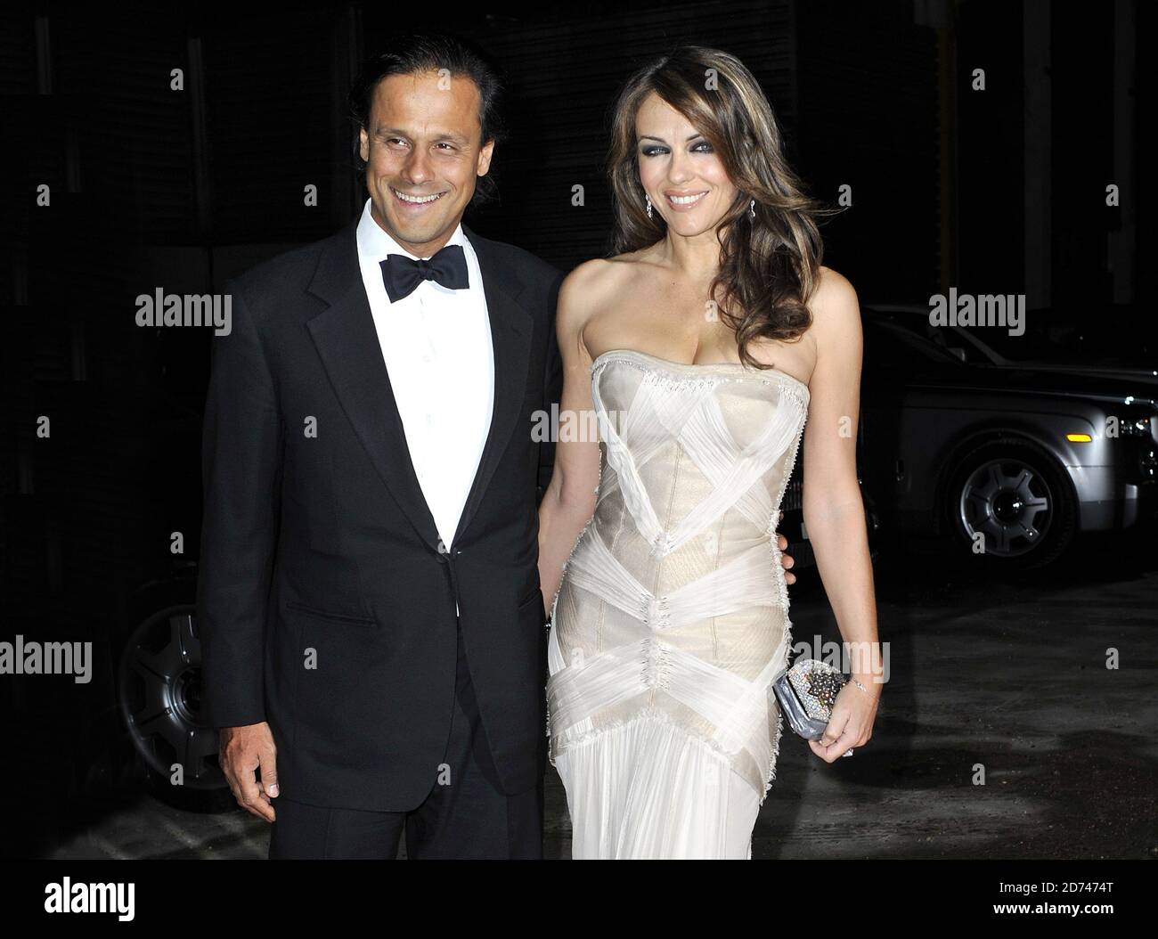 Elizabeth Hurley and Arun Nayar arrive at the Elton John AIDS Foundation Winter Ball, at Maison de Mode in Vauxhall, south London.  Stock Photo