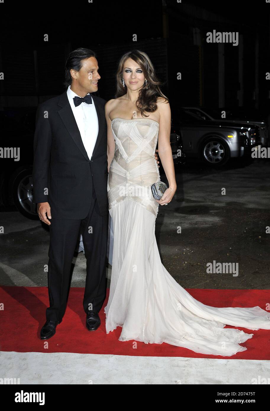Elizabeth Hurley and Arun Nayar arrive at the Elton John AIDS Foundation Winter Ball, at Maison de Mode in Vauxhall, south London.  Stock Photo