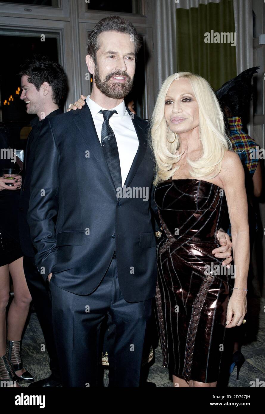 Rupert Everett and Donatella Versace attending the Central Saint Martinâ€™s 20:20 Fashion Fund dinner, at the Connaught Hotel in central London.  Stock Photo