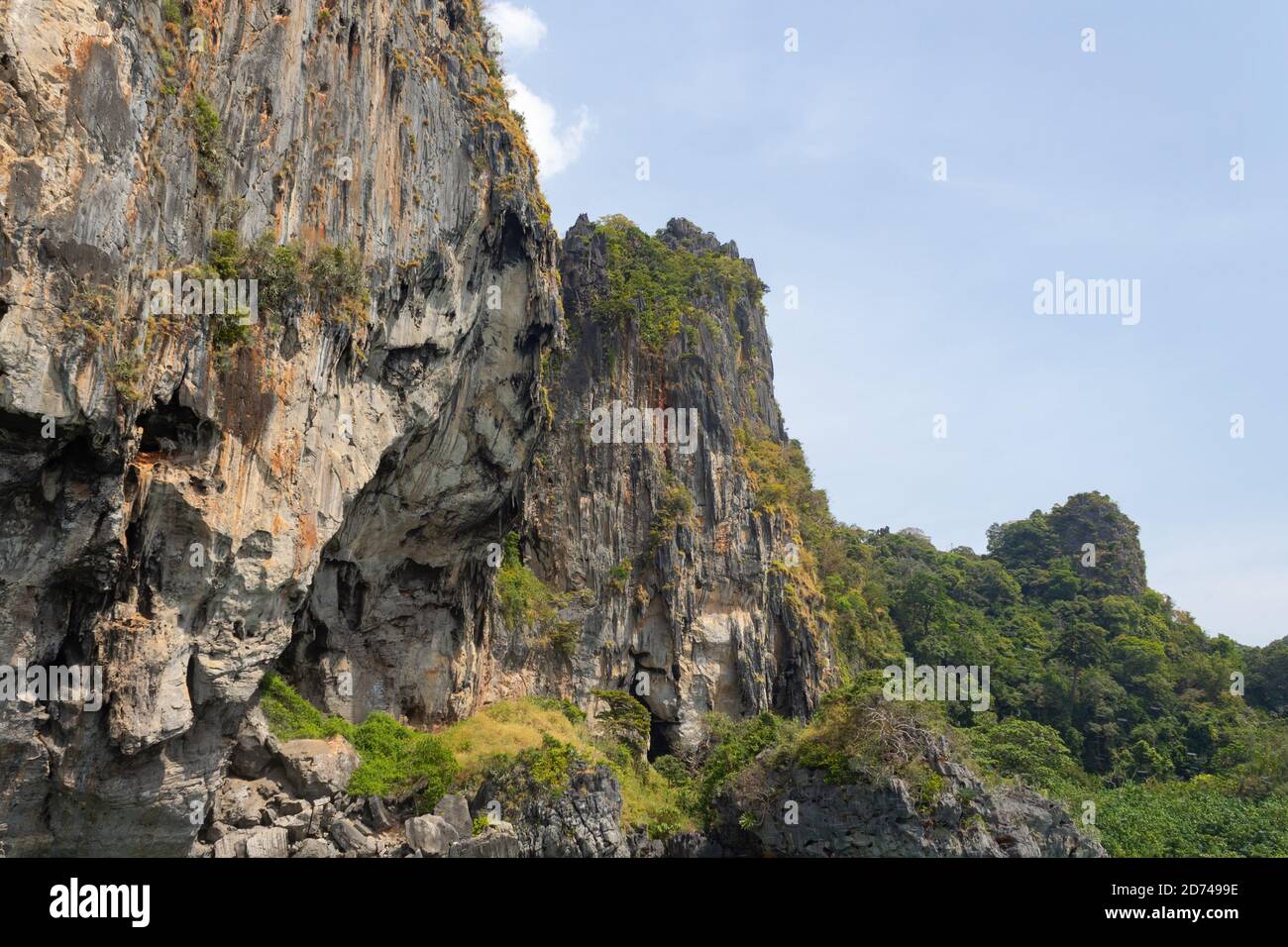 Yellow grey beautiful rock against the blue sky Stock Photo