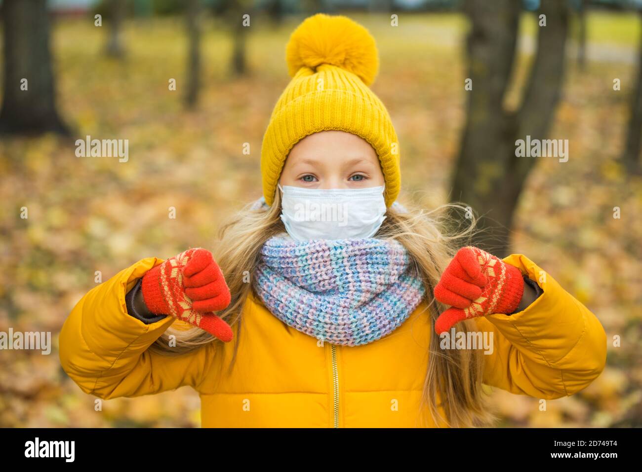 blond Girl wearing respirator mask in autumn Stock Photo Alamy