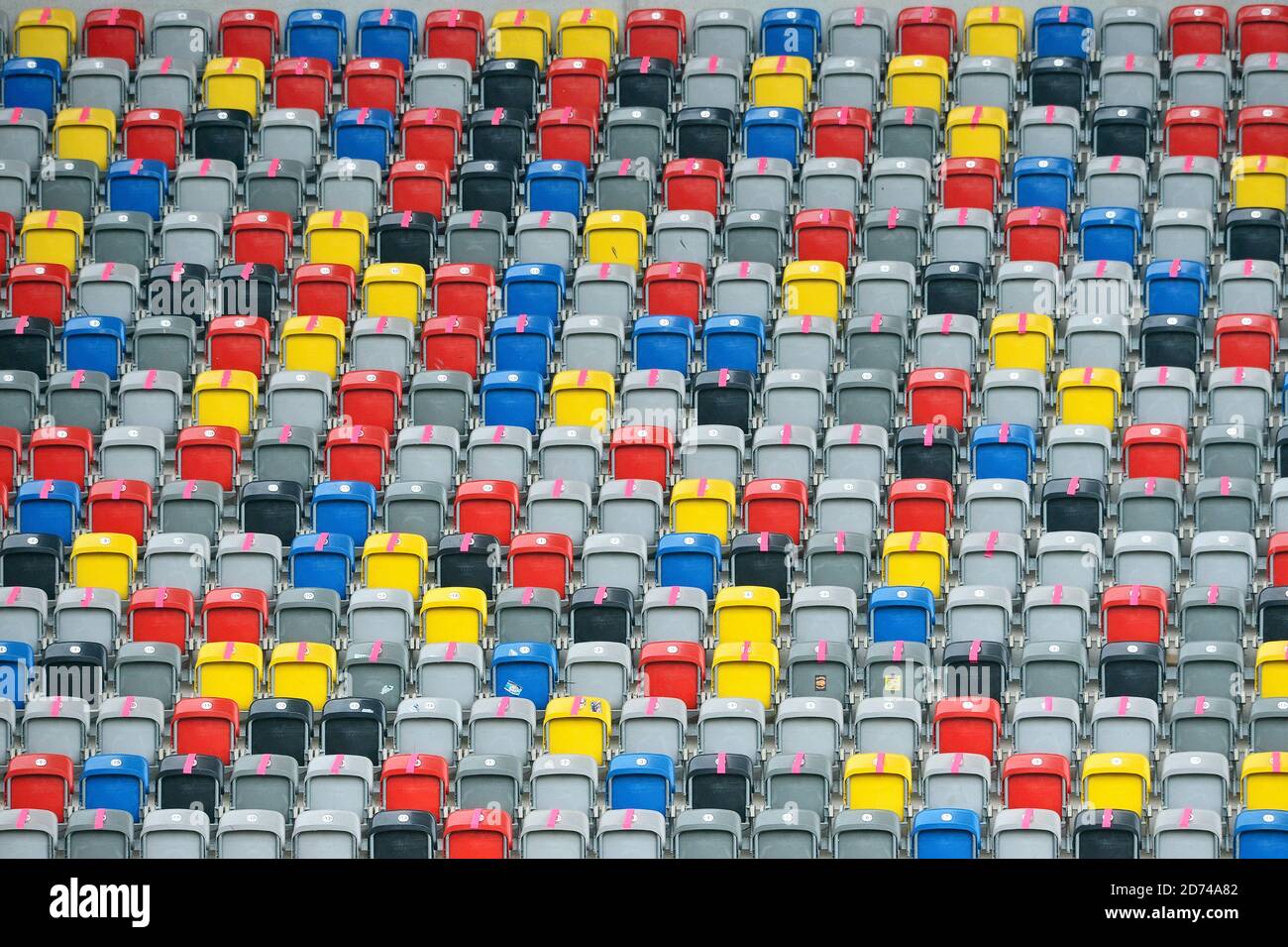 The colorful seating shells in the empty Merkur Spiel Arena in Dusseldorf, Germany. Stock Photo