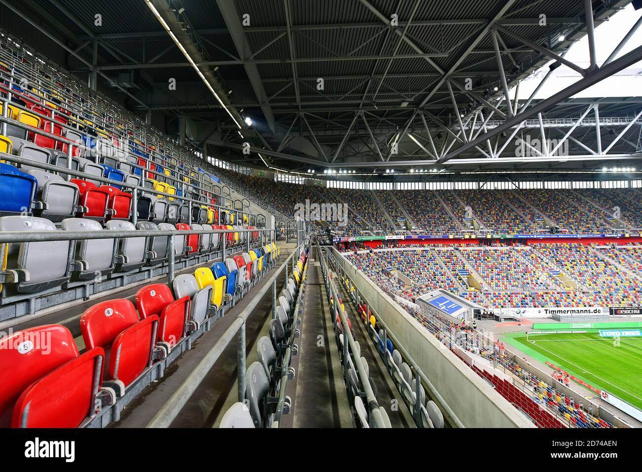 The colorful seating shells in the empty Merkur Spiel Arena in Dusseldorf,  Germany Stock Photo - Alamy