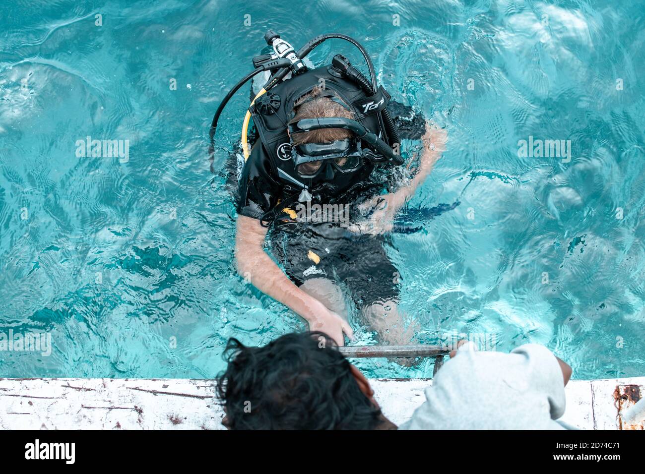 Calventuras islands, Ngwesaung, Myanmar, December 29, 2019: A scuba diver in full equipment at the turquoise water surface Stock Photo