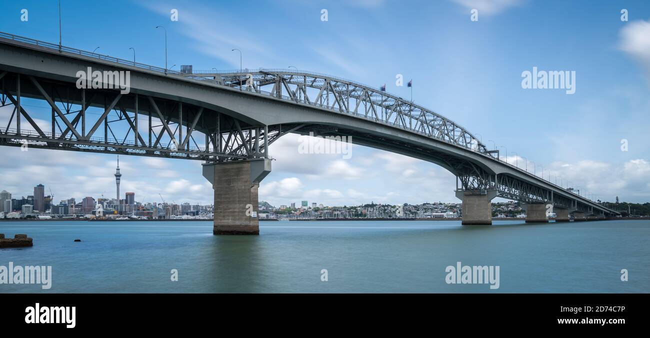 Auckland Harbour Bridge in Auckland, New Zealand, shot from Northcote using long exposure. The bridge joins St Marys Bay on the Auckland city side Stock Photo