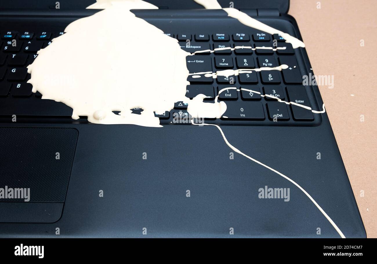 Laptop ruined with spilled paint Stock Photo Alamy