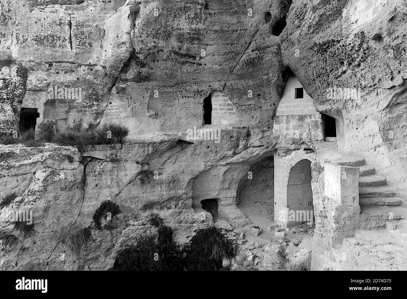 The Ofra complex - Matera is an agglomeration of caves which develops along a rock wall overlooking the Gravina, on four levels communicating through Stock Photo