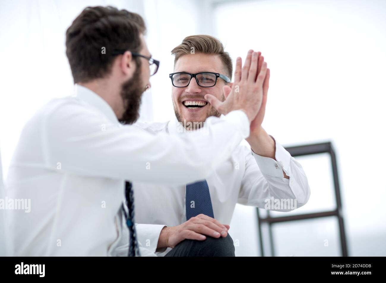 close up. two successful employees giving each other a high five Stock ...