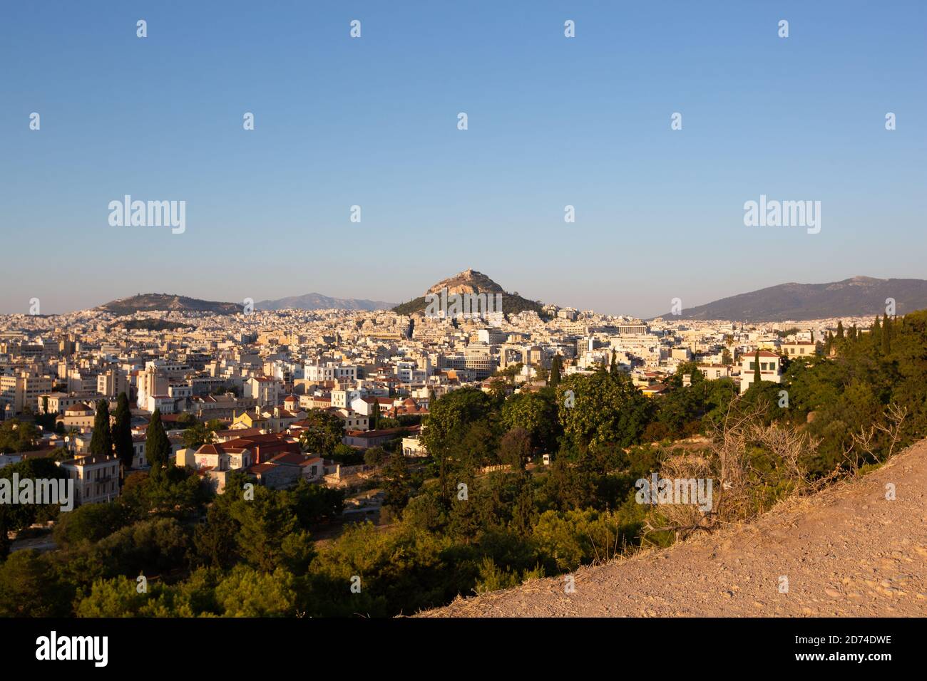 Wide view of Athens Cityscape and Mount Lycabettus at Sunset Scenic view Stock Photo