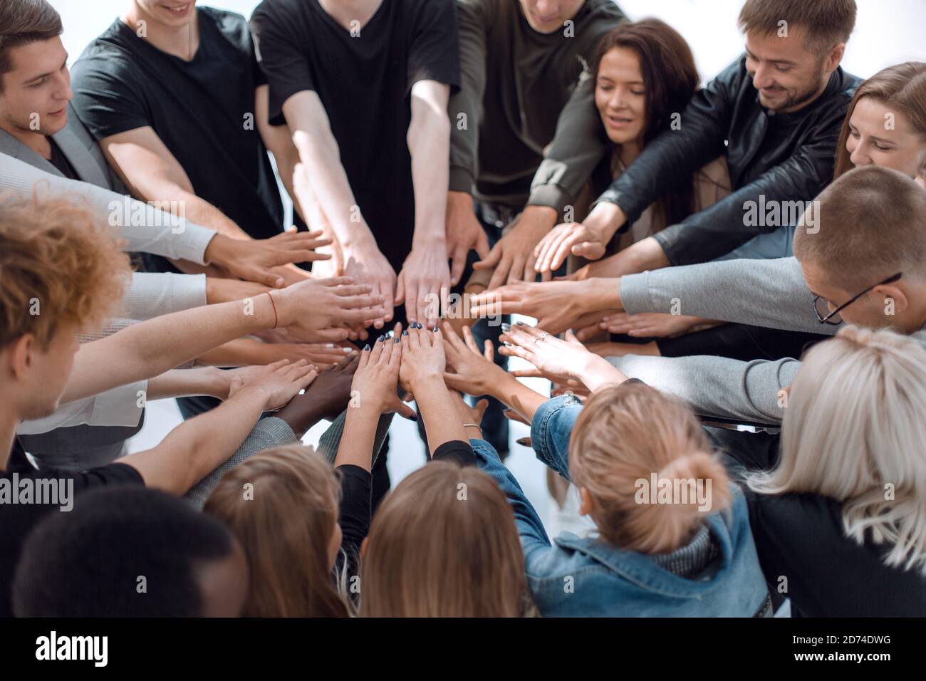 group of diverse people joining their hands in a circle Stock Photo - Alamy