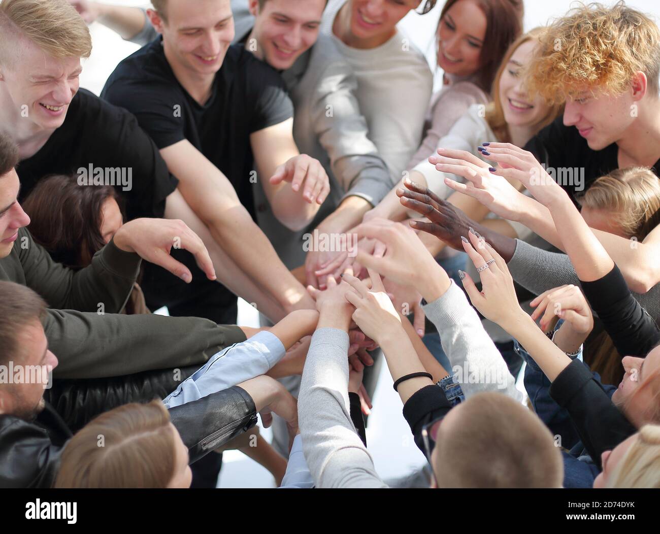 group of diverse people joining their hands in a circle Stock Photo - Alamy