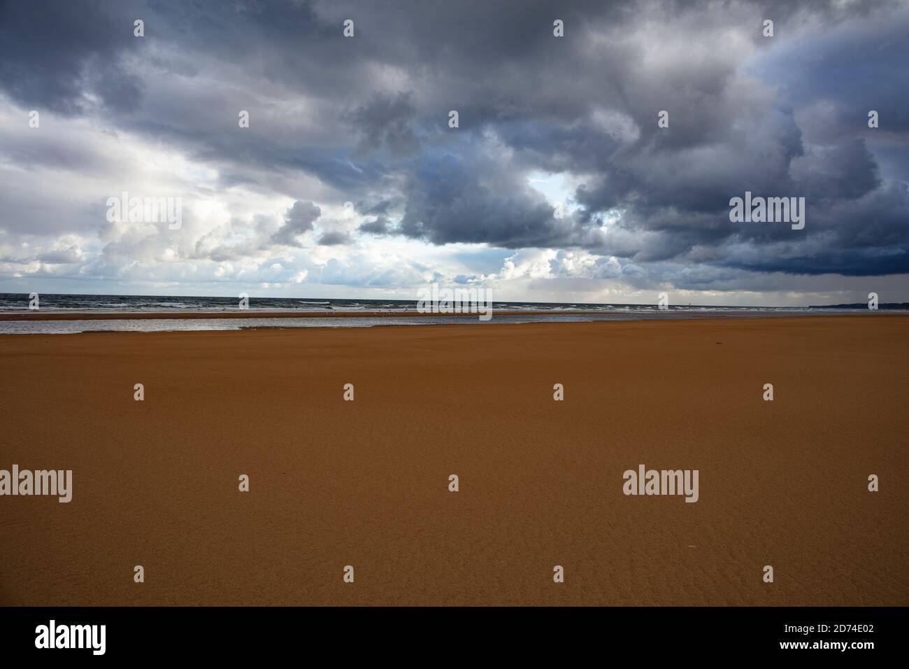 Omaha beach, empty and lonely with a dramatic sky Stock Photo