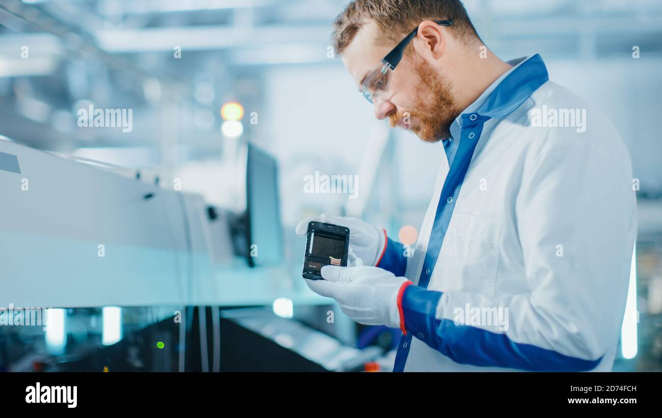 High Tech Quality Testing High tech quality control inspector hi-res stock photography and images ...