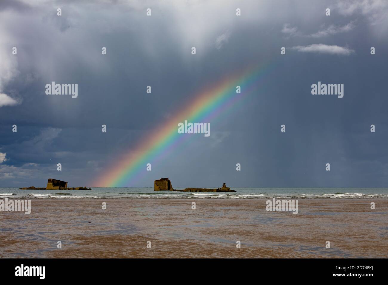 Rainbow between dark clouds hi-res stock photography and images - Alamy