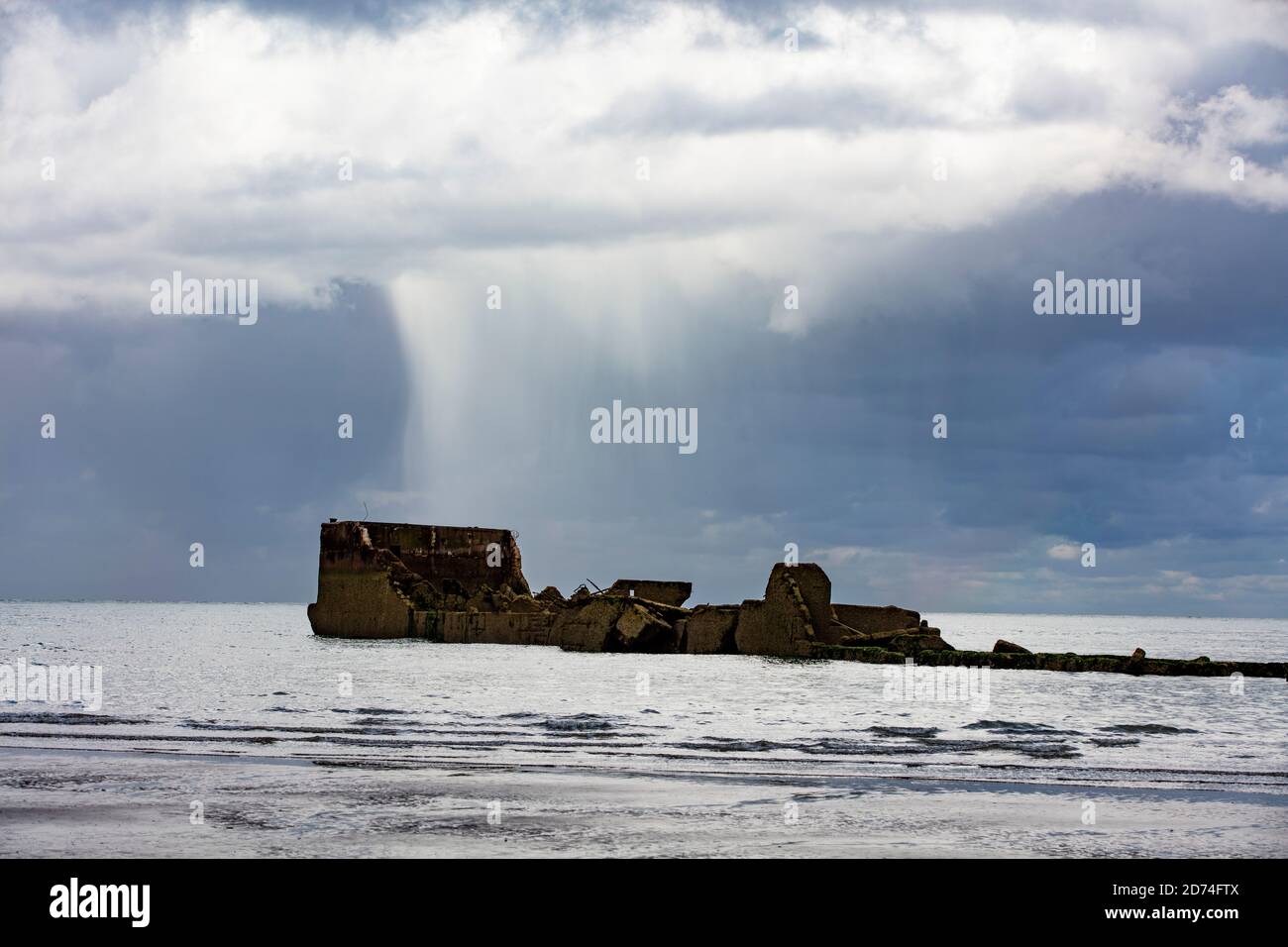 Normandy beach with wracks of the D-Day Stock Photo