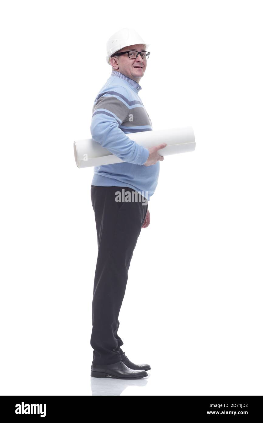 side view. a man with a roll of drawings looking somewhere ahead. Stock Photo