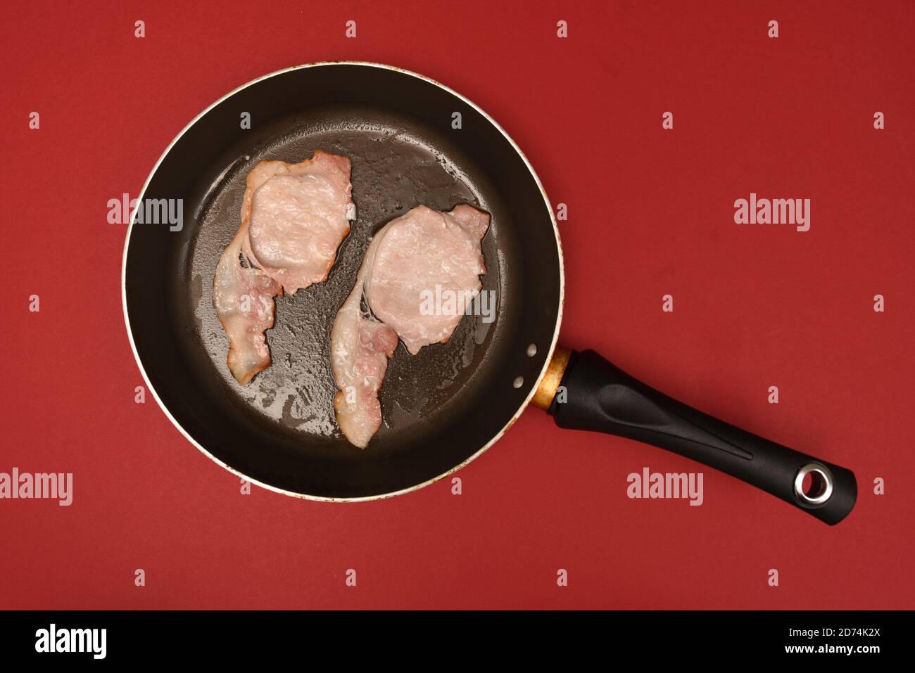 fried bacon in a frying pan Stock Photo Alamy