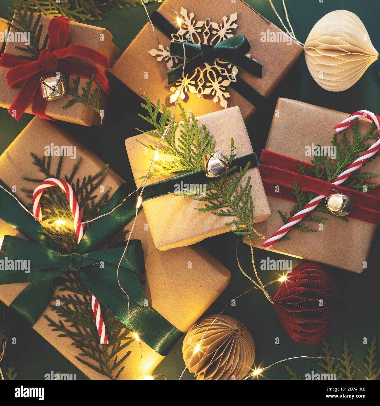 Many Christmas gift boxes tied velvet ribbons with paper decorations in