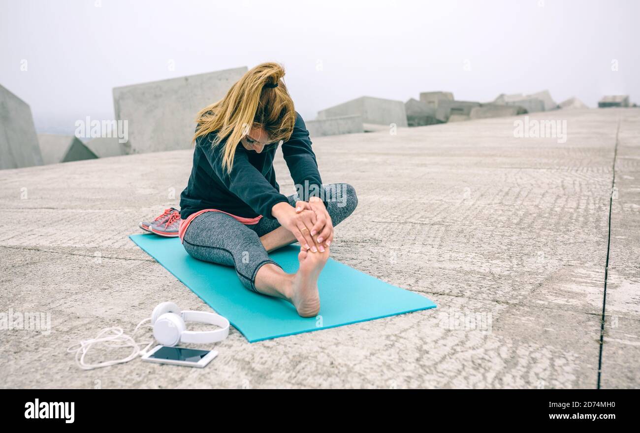Woman stretching legs outside hi-res stock photography and images - Alamy