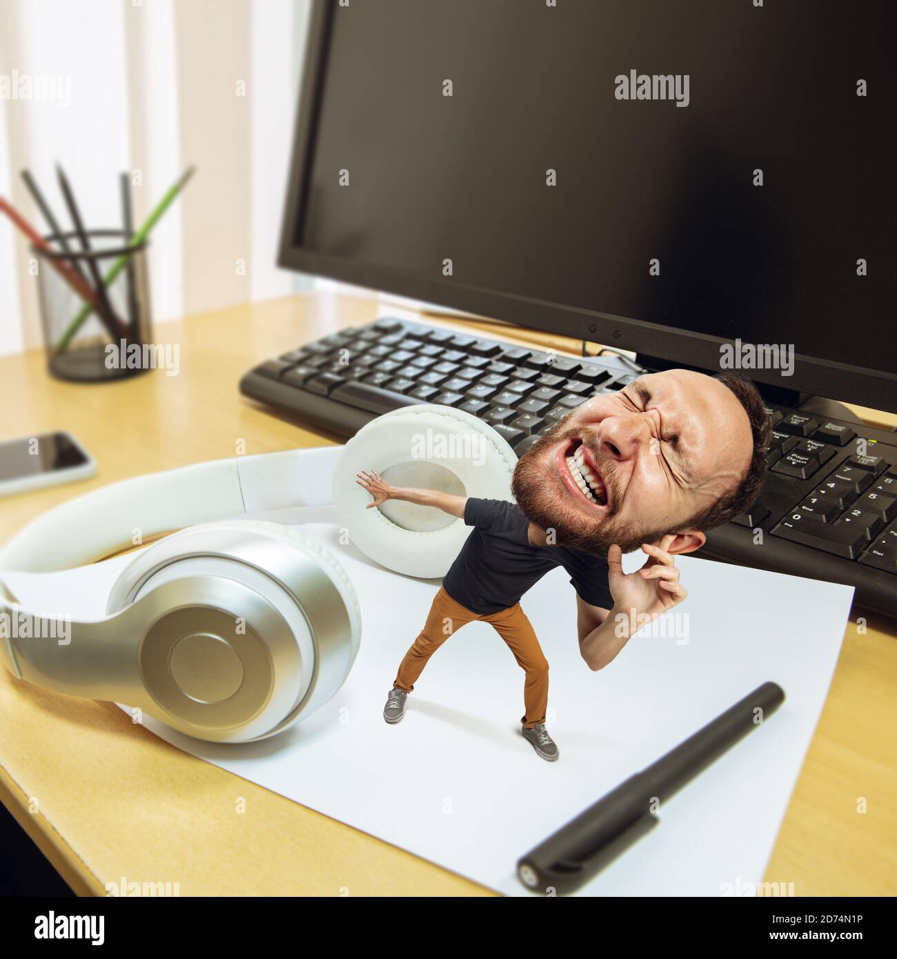 Hell. Tired man, office worker holding his huge tired head, funny. Overworked caucasian man with little body and huge head looks stressed, shocked at big workplace. Concept of work, job, deadline. Stock Photo