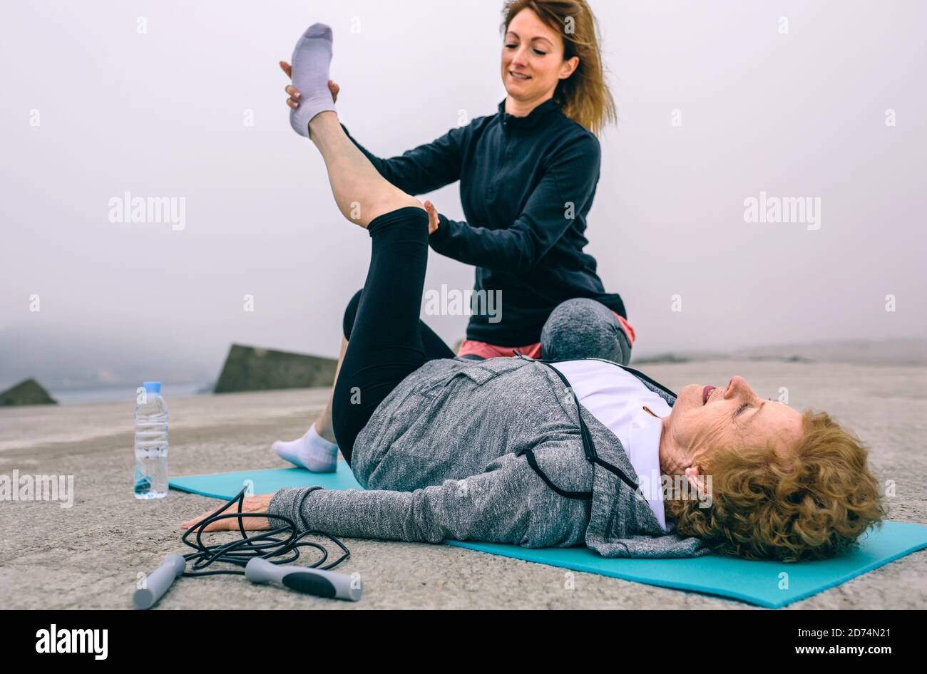 Senior woman with personal trainer Stock Photo