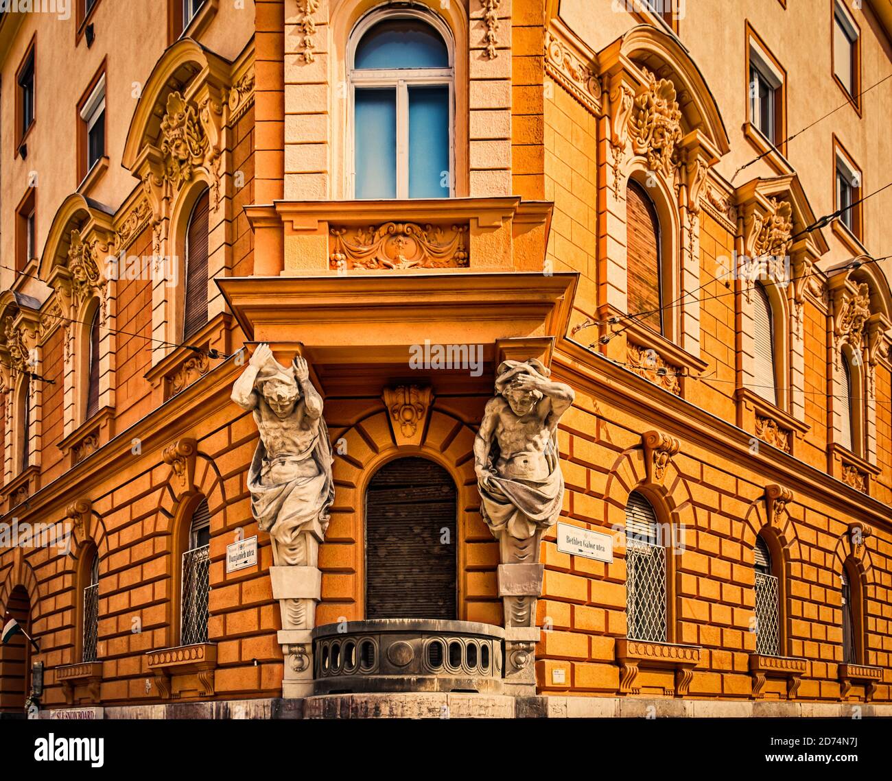 Budapest, Hungary, March 2020, close up of a corner building with architectural sculpture at Bethlen Gabor and Damjanich street Stock Photo