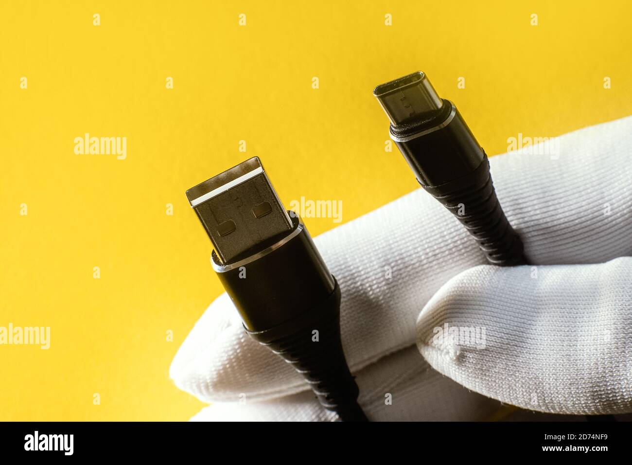 USB cable from USB to USB 3.1 type C. abstract yellow background for ad design Stock Photo