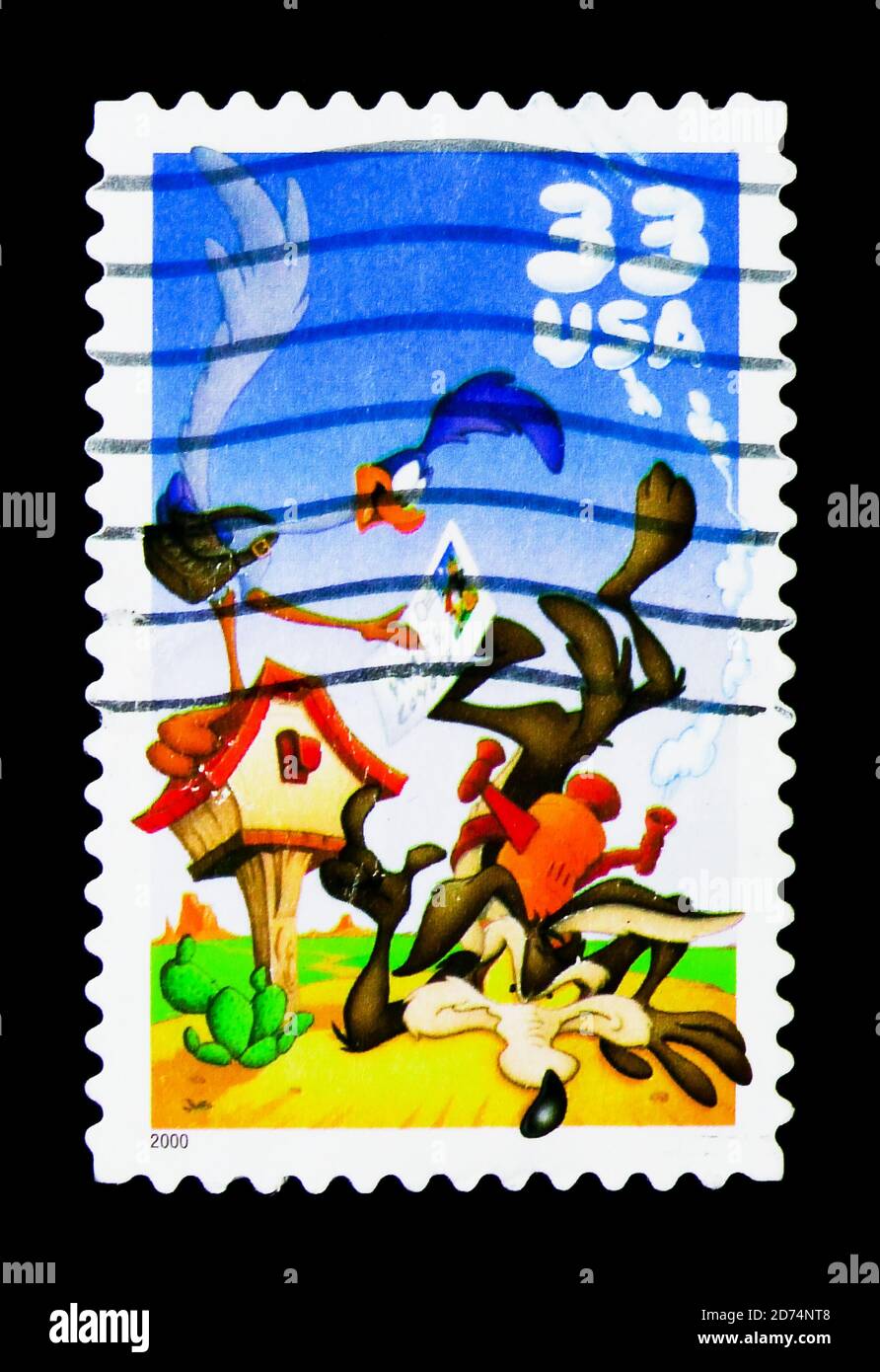 MOSCOW, RUSSIA - NOVEMBER 24, 2017: A stamp printed in USA shows Road Runner and Wile E. Coyote,  Looney Tunes serie, circa 2000 Stock Photo