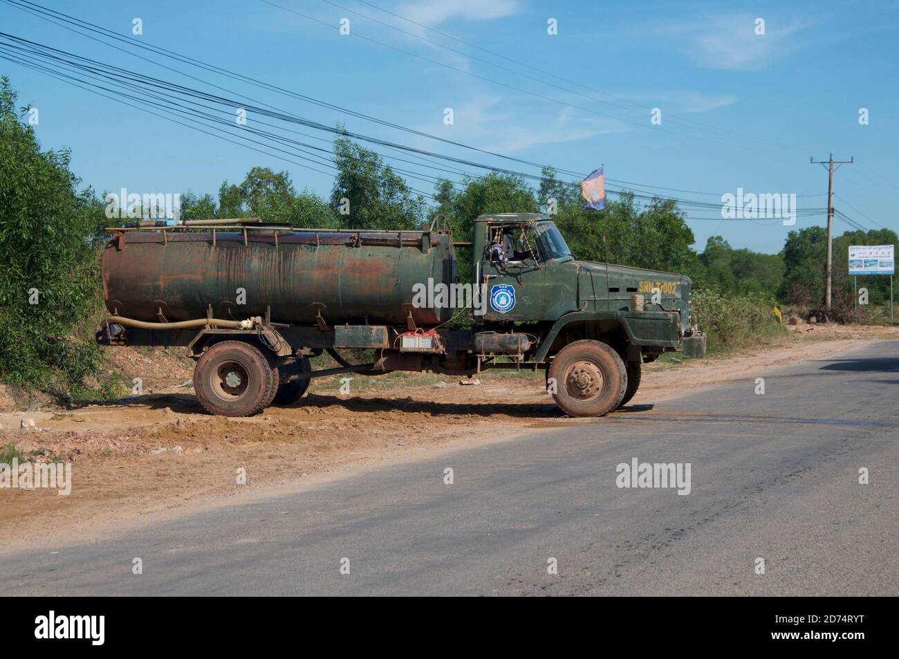 Sihanoukville, Cambodia - 30th December 2018 : View of a typical old and rusty fuel truck maneuvering on a street in Sihanoukville, Cambodia Stock Photo