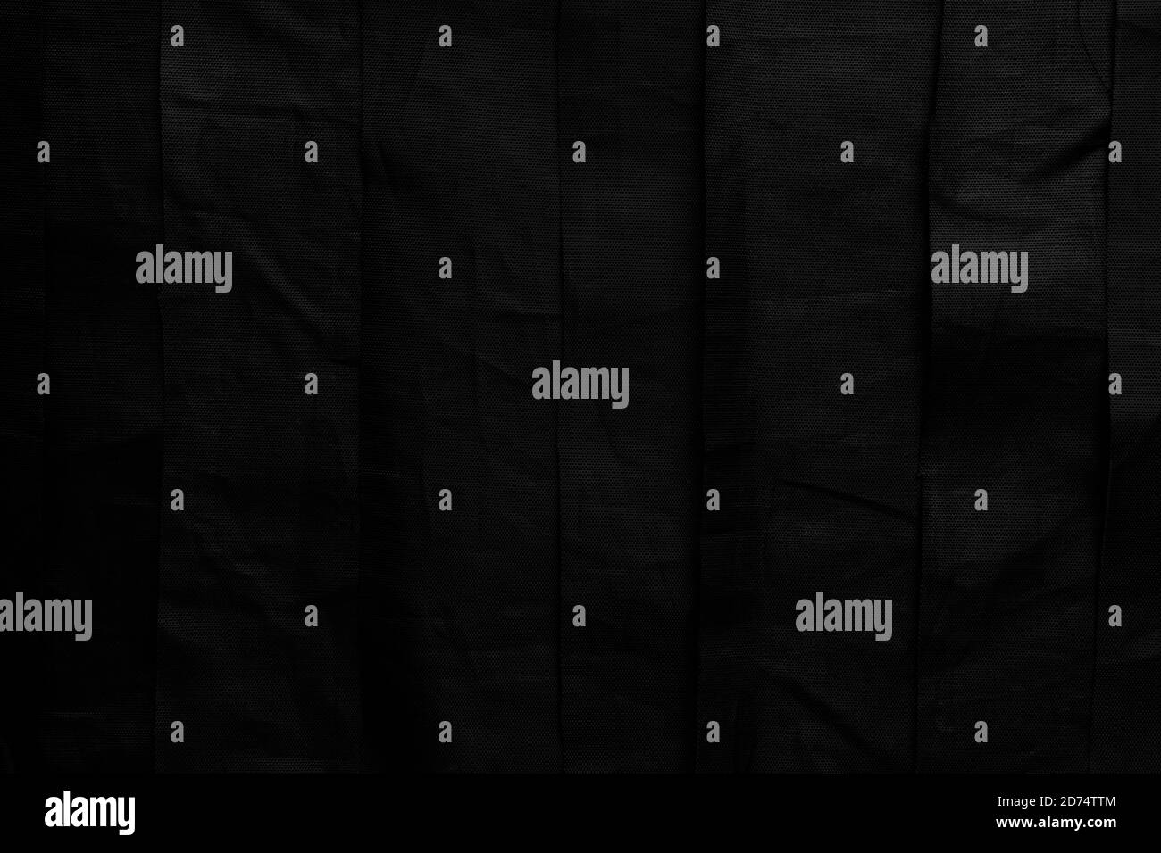 Black material. Crumpled Uneven Stripes Grunge Texture. Abstract dark