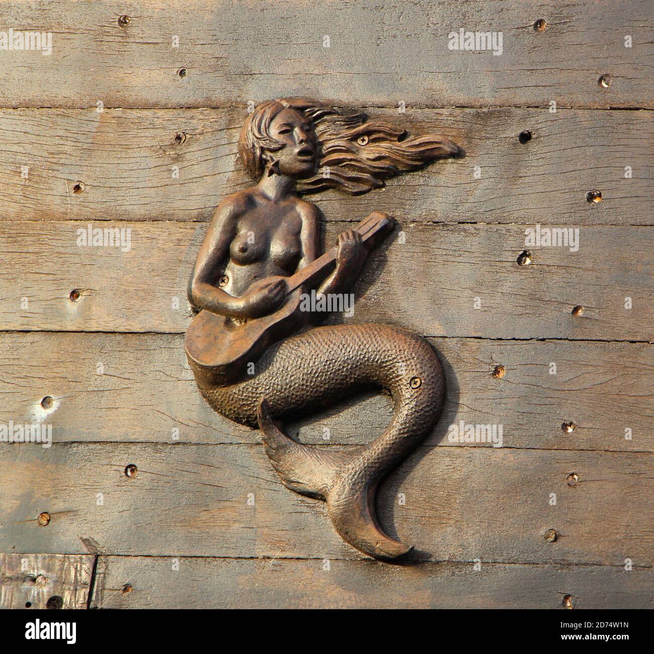 Poly wood carved like brown sea mermaid figurine 8x6 inches  