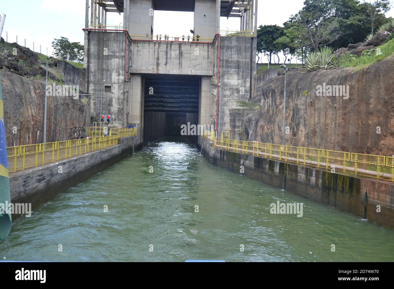 Dam, with an internal view in a freshwater river, iron and concrete structure, with side walls and dam command control building, in photo zoom Stock Photo
