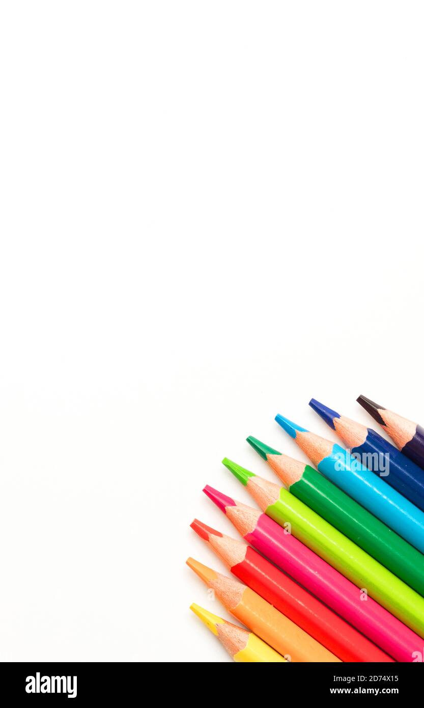 Colored pencils in a circle, white background, top view Stock Photo