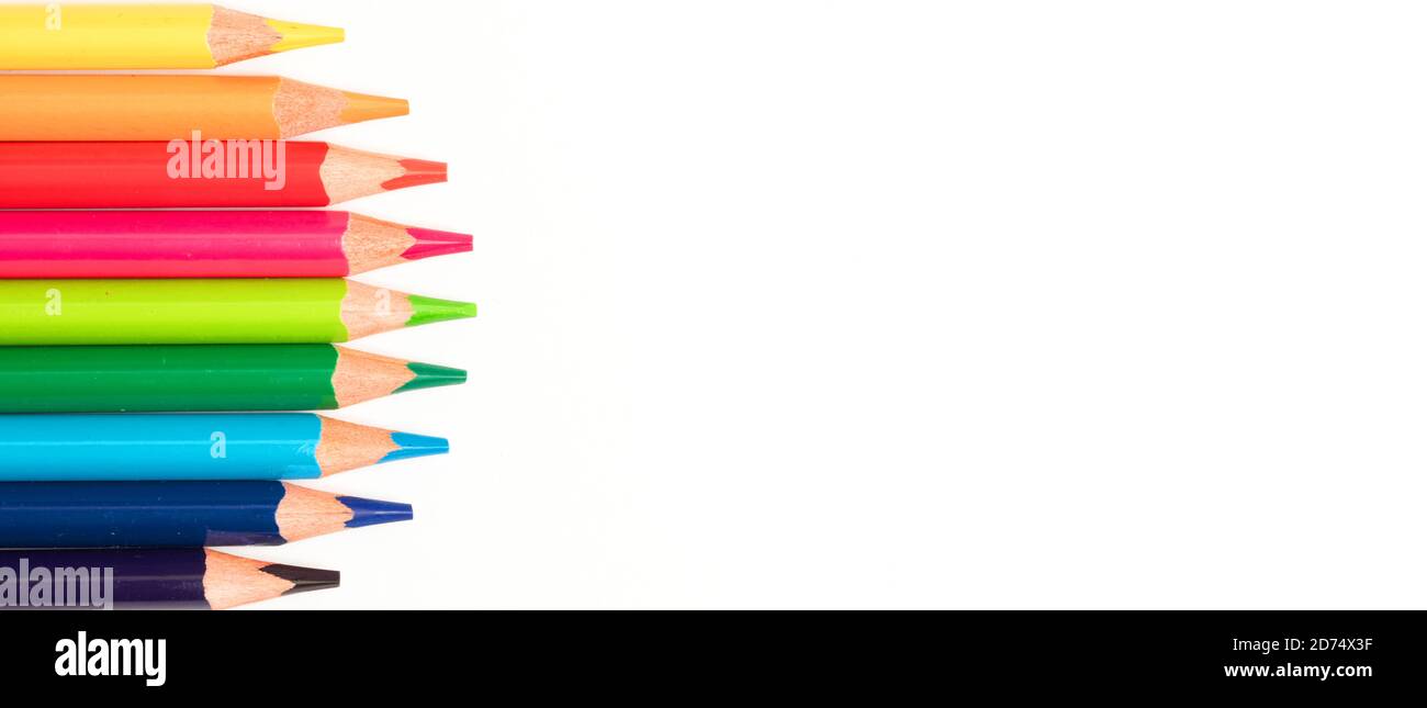 Colored pencils in a circle, white background, top view Stock Photo