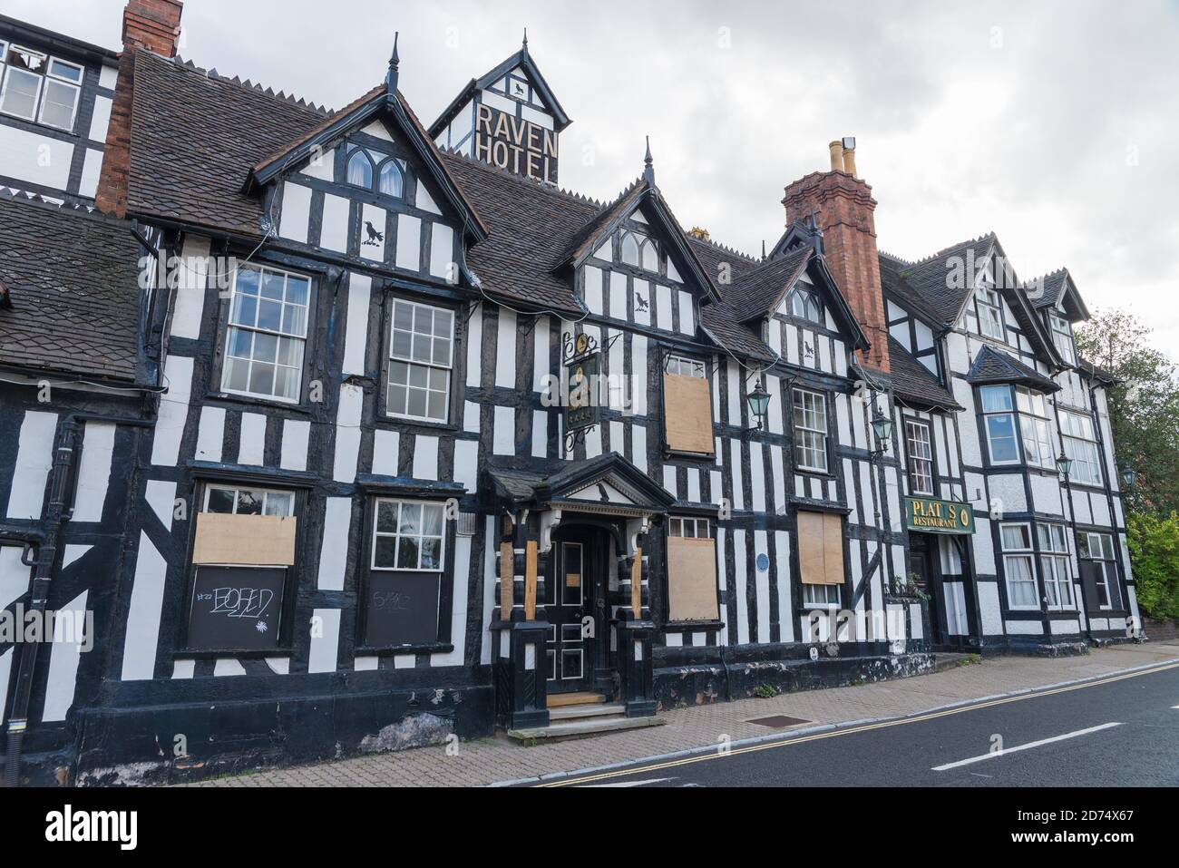 The boarded-up closed down Raven Hotel in Droitwich Spa,Worcestershire is a large black and white timber-framed building will be converted into homes Stock Photo