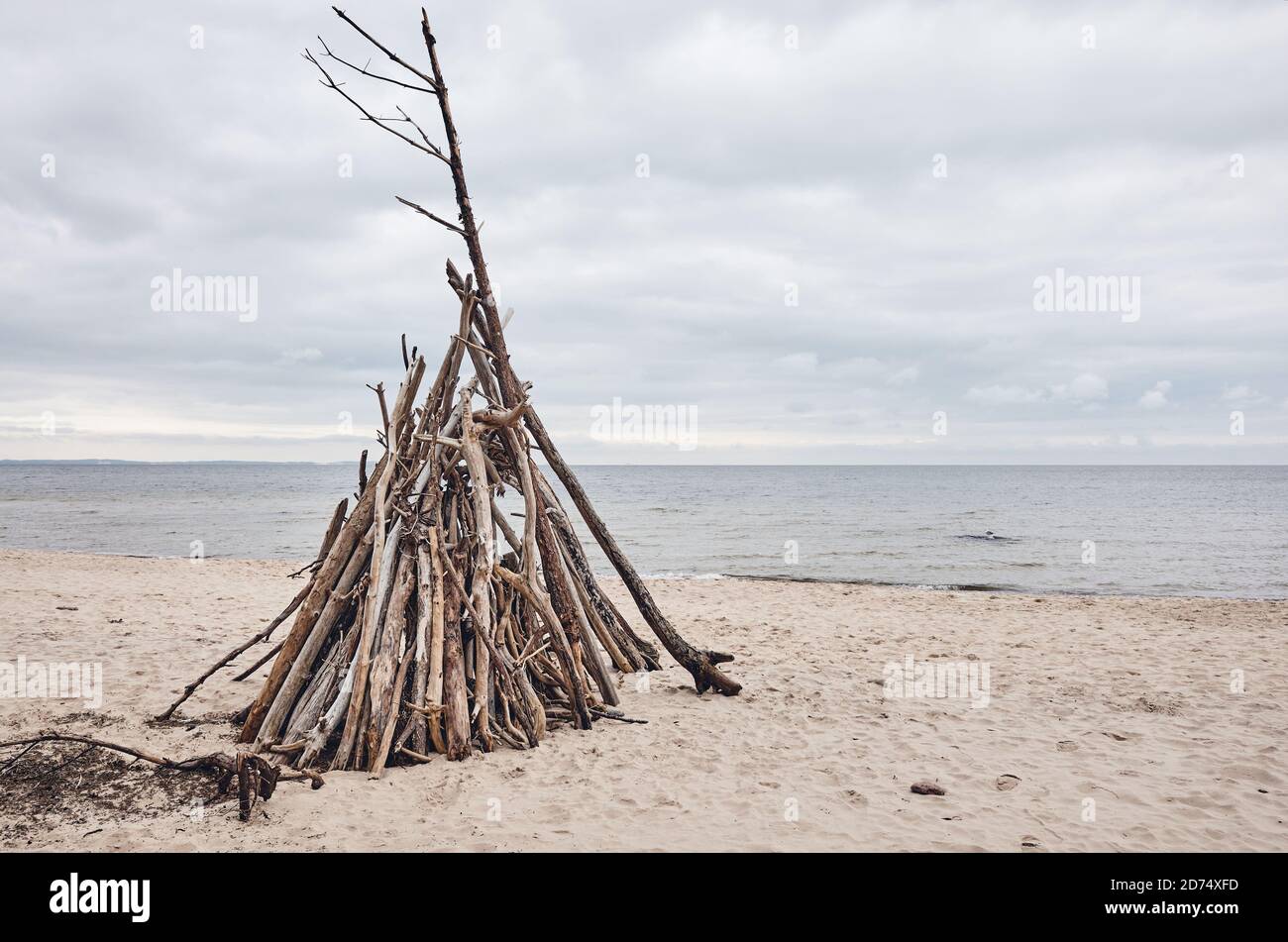 Temporary wood shelter on an empty beach. Stock Photo