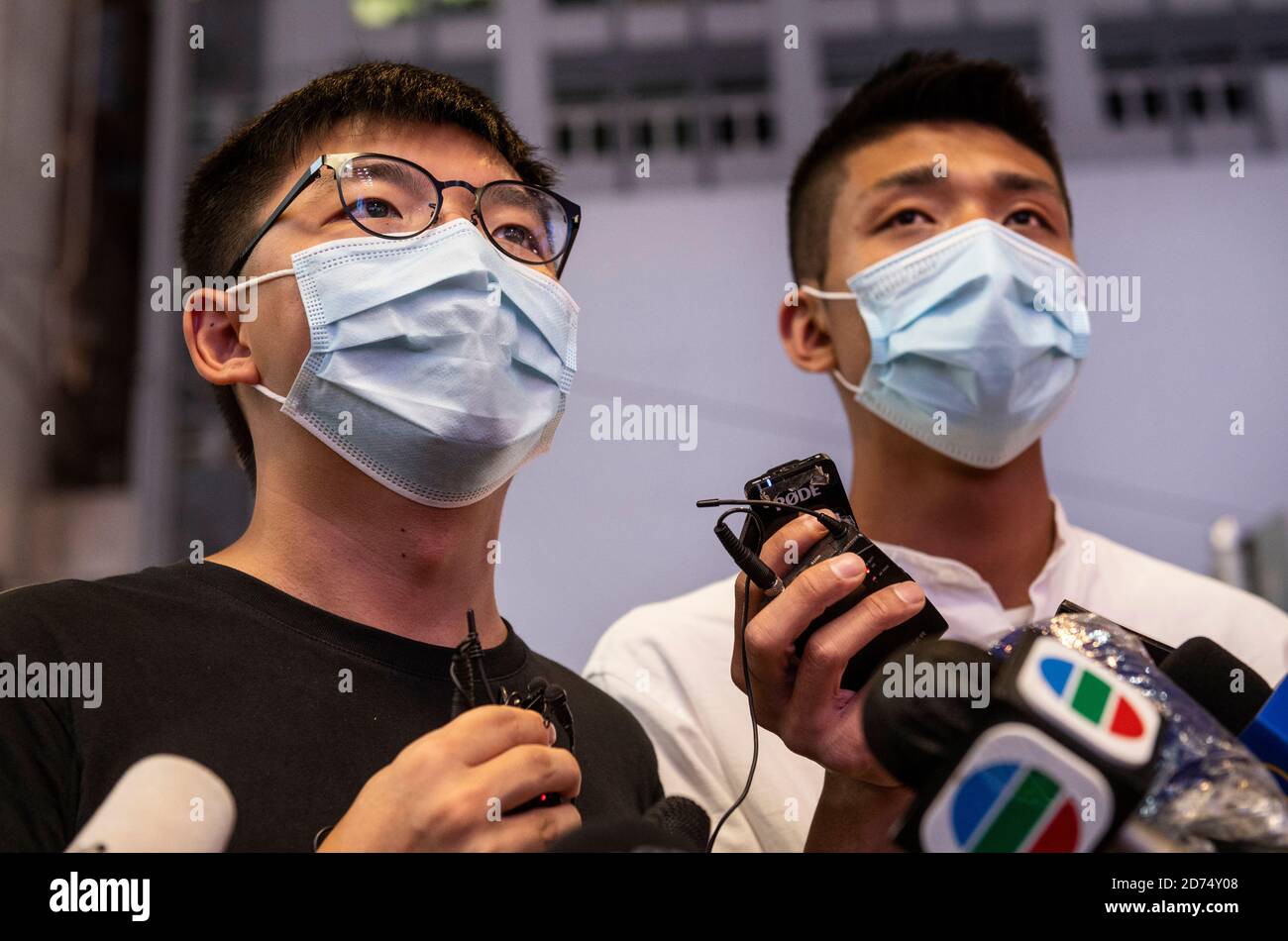 Pro-democracy activists Joshua Wong (L) and Owen Chow (R) speak to the press during the rally.Pro democracy activates rally in Hong Kong in support of the 12 Hongkongers detained in Mainland China after allegedly trying to flee to Taiwan to claim political asylum in August 2020. The 12 detainees has committed different political crimes in Hong Kong and were on court bail when they fled. Stock Photo