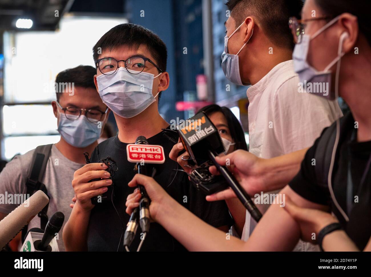 Pro-democracy activist Joshua Wong speaks to the press during the rally.Pro democracy activates rally in Hong Kong in support of the 12 Hongkongers detained in Mainland China after allegedly trying to flee to Taiwan to claim political asylum in August 2020. The 12 detainees has committed different political crimes in Hong Kong and were on court bail when they fled. Stock Photo