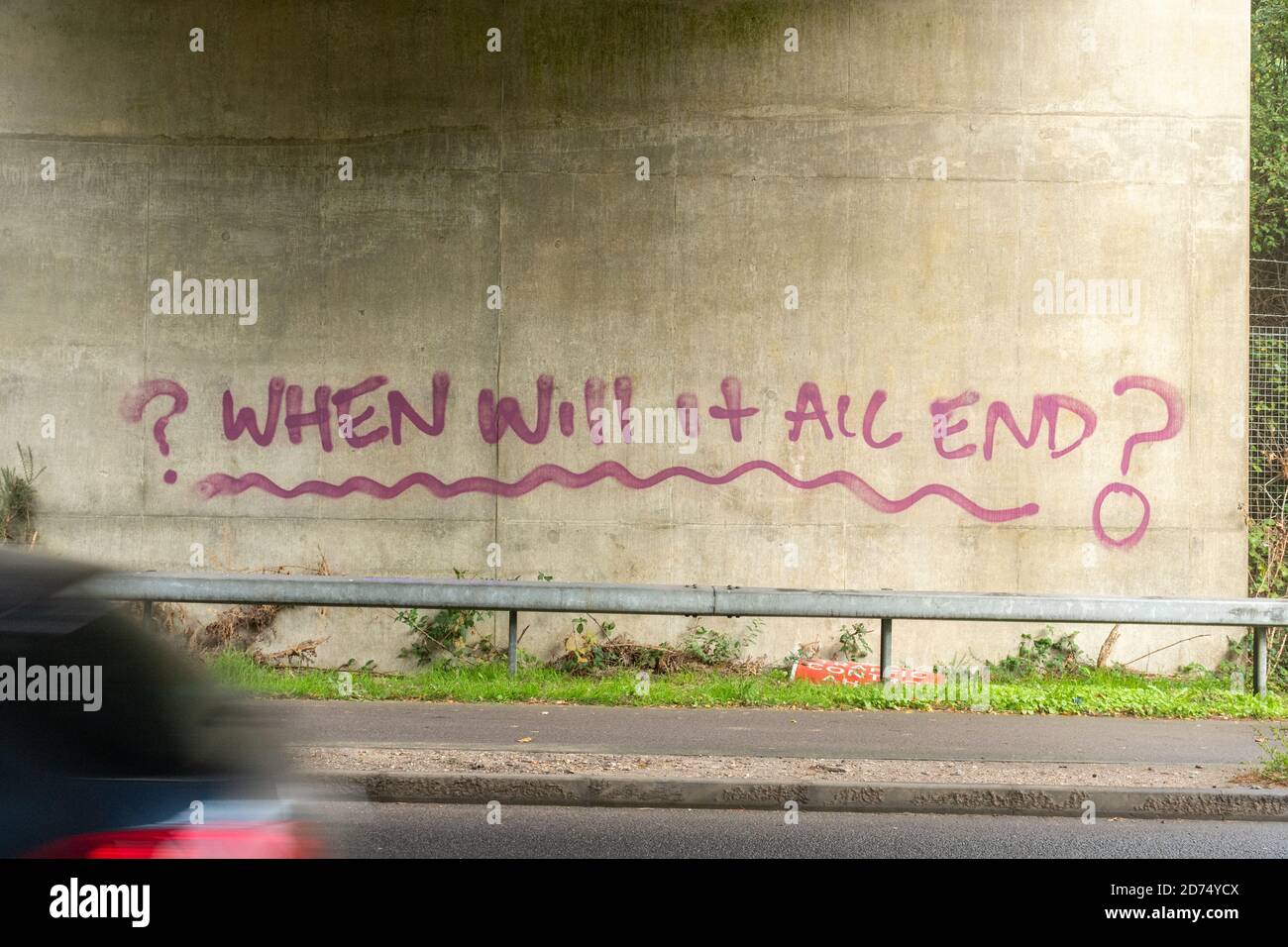 Graffiti asking When Will it all End? painted under a bridge in reference to the coronavirus covid-19 pandemic in 2020, UK Stock Photo