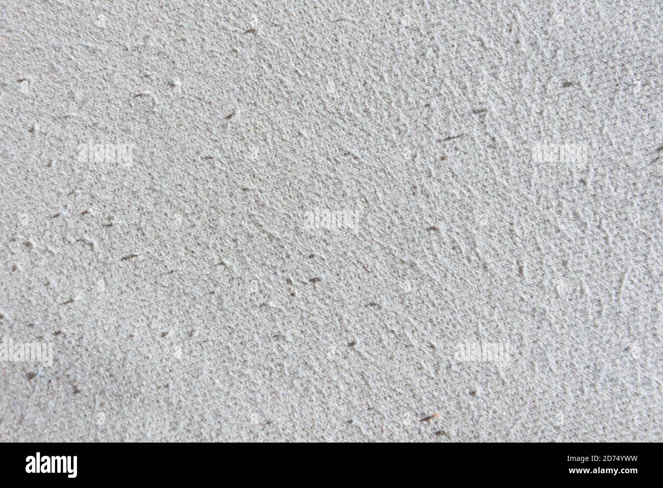 Cotton beige fabric surface texture with pills traces of wear, outdated, used Stock Photo