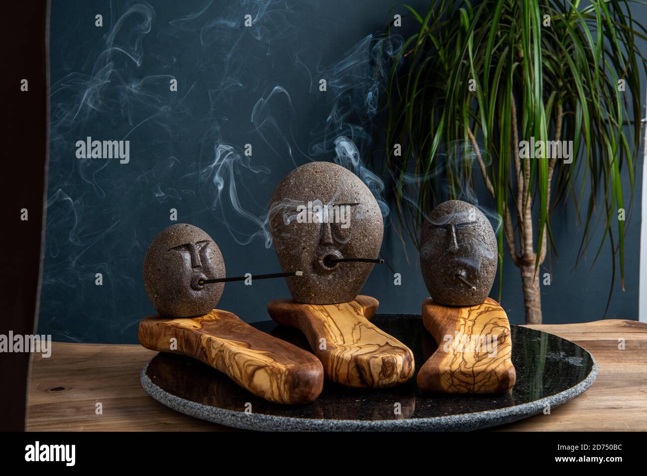 stone incense stands with smoke Stock Photo Alamy