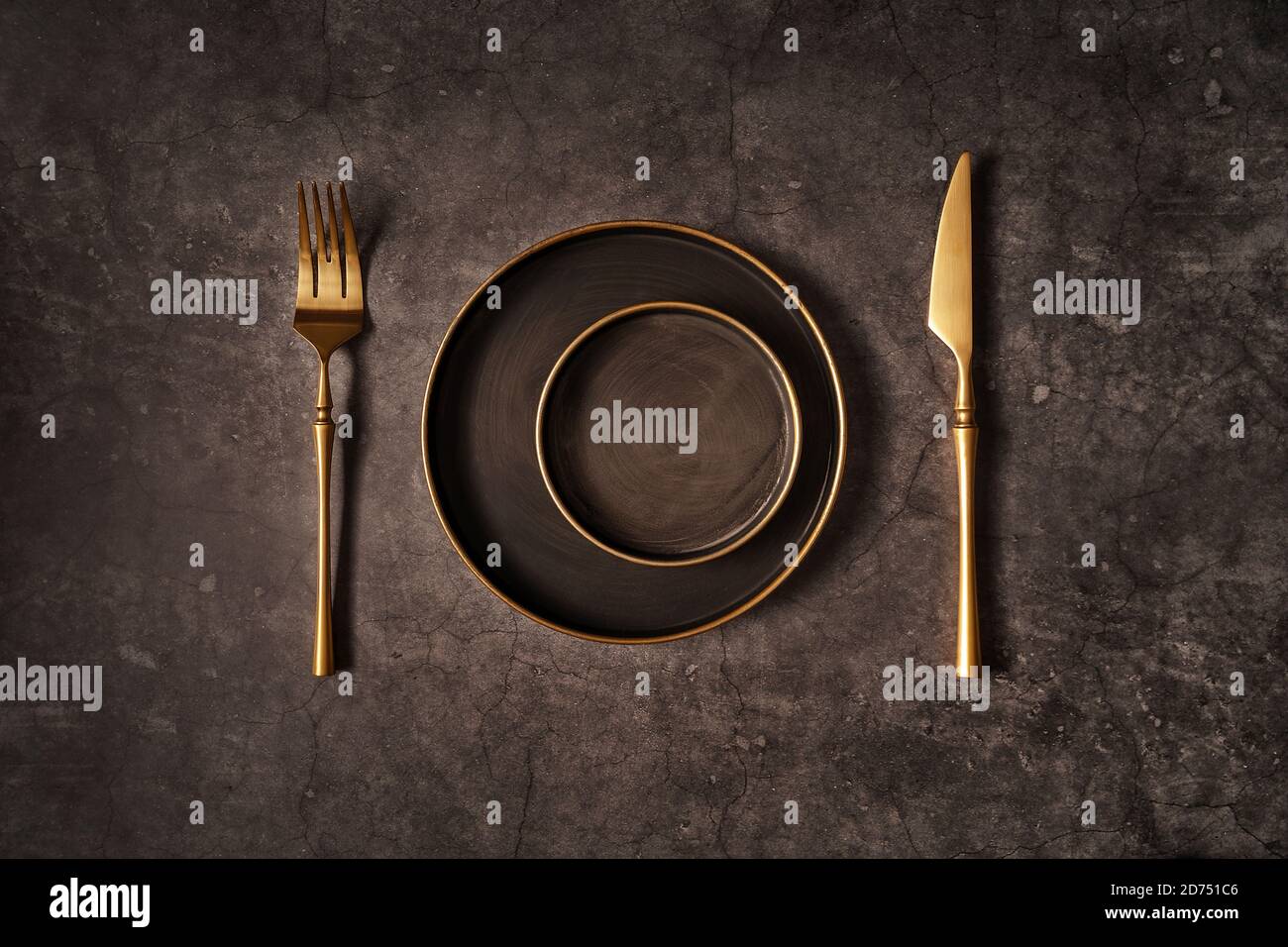Vintage template with old metal plates and golden knife and fork on