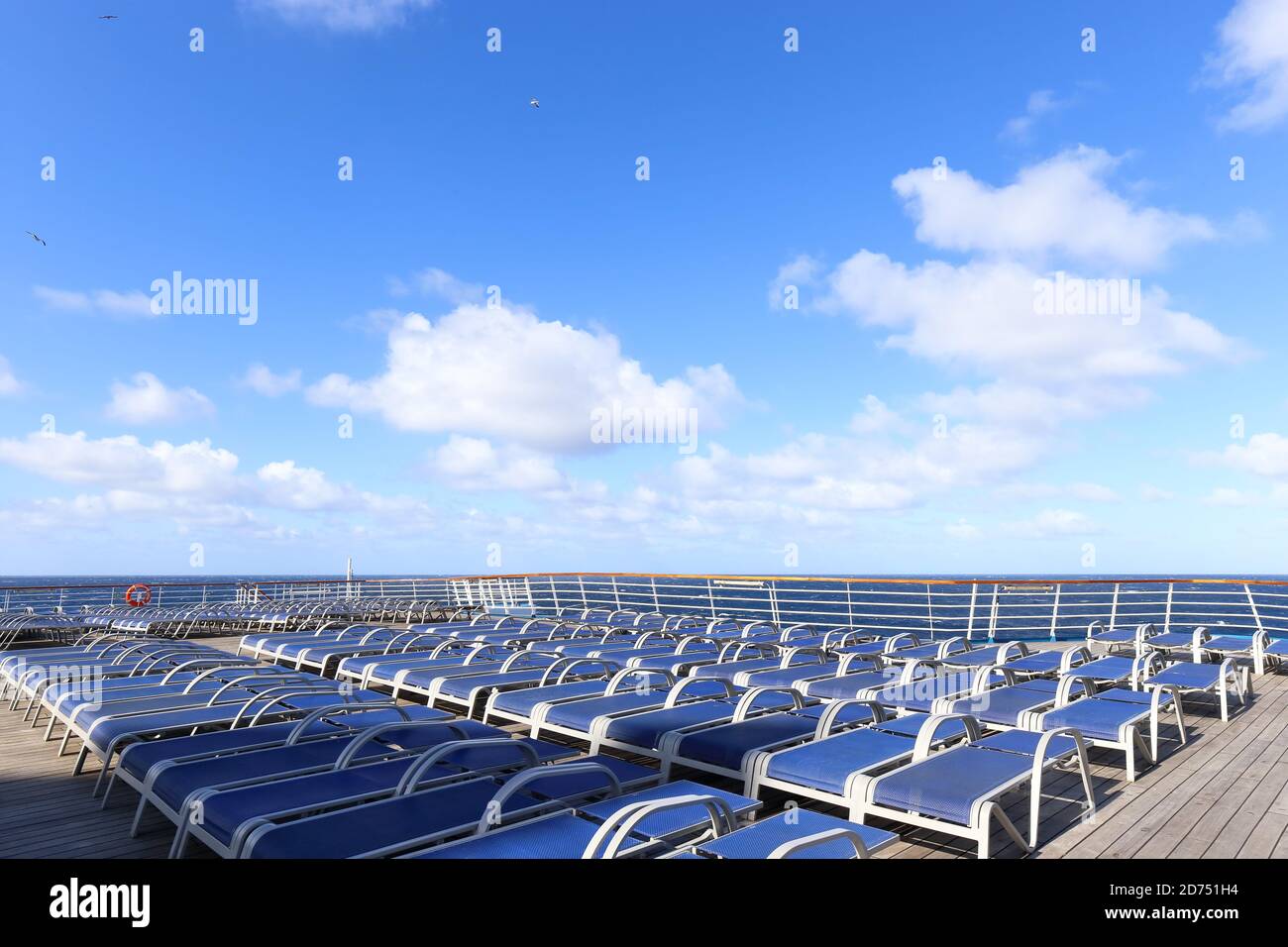 sun bathing beds on a deck of cruise ship in the pacific ocean on a sunny day Stock Photo