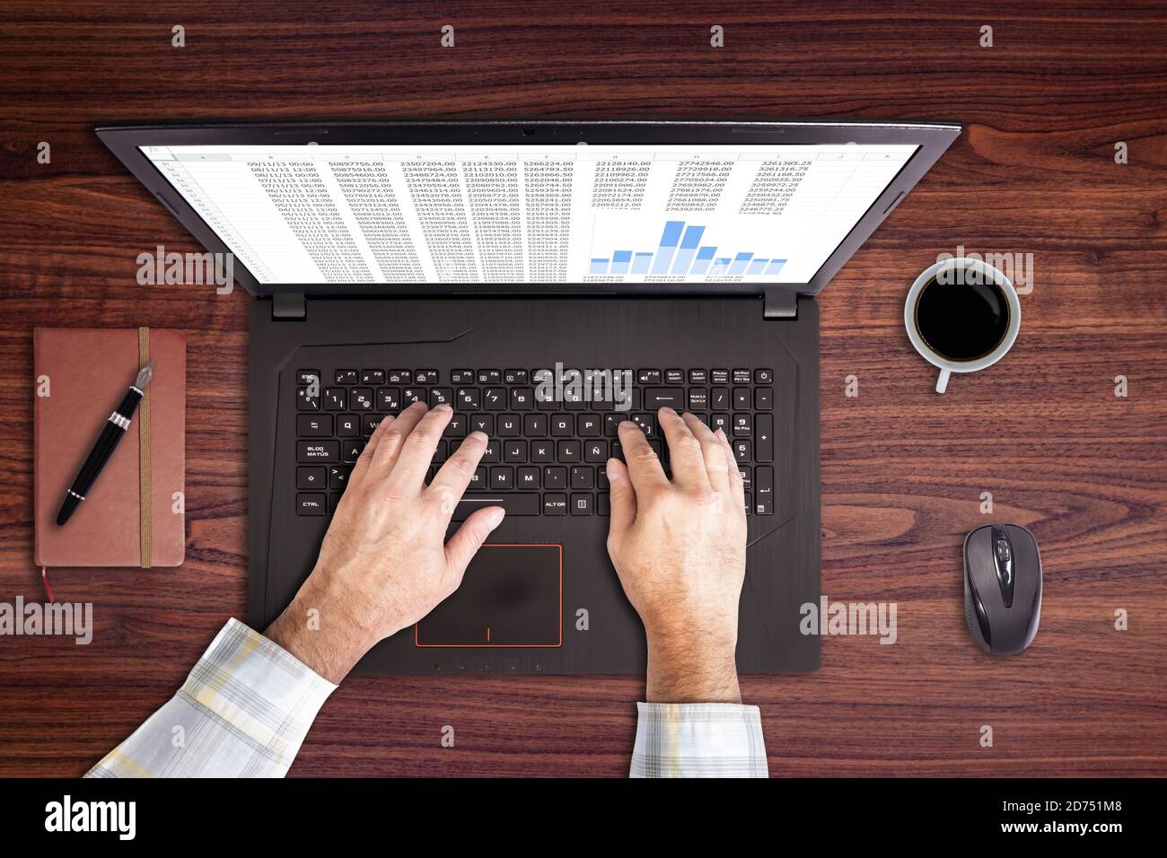 Using laptop with a cup of coffee Stock Photo